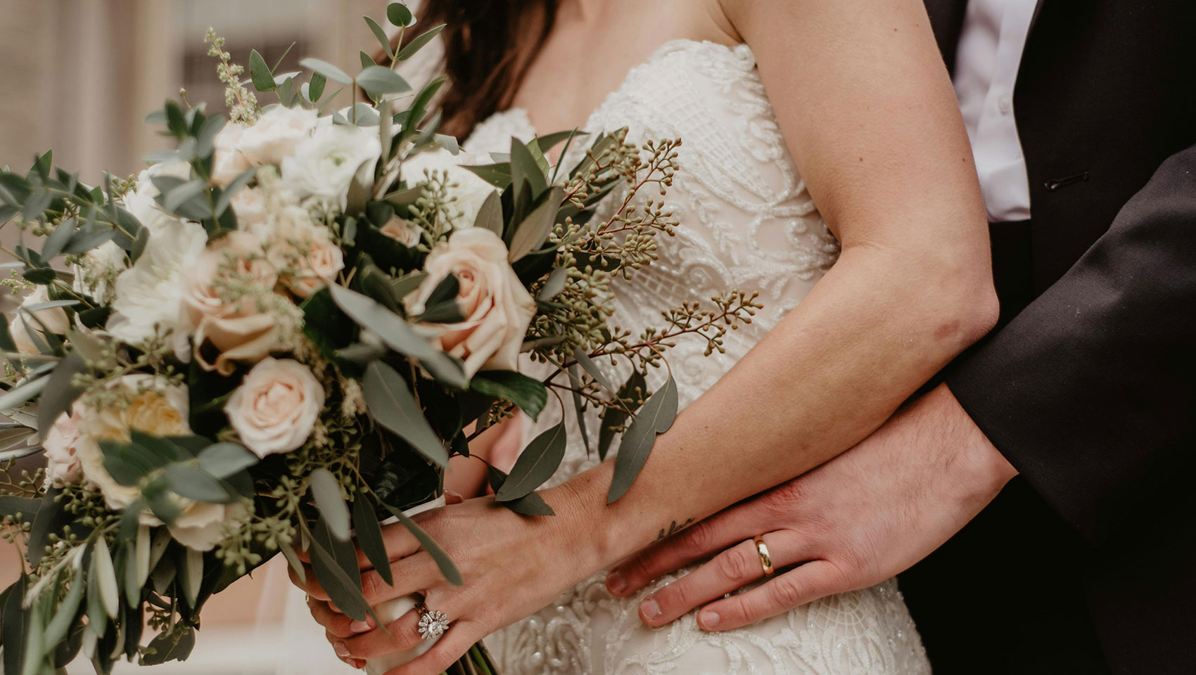 bride and groom holding flowers