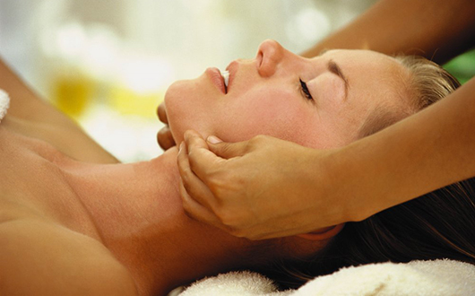 woman receives face massage in seattle Vintage Seattle